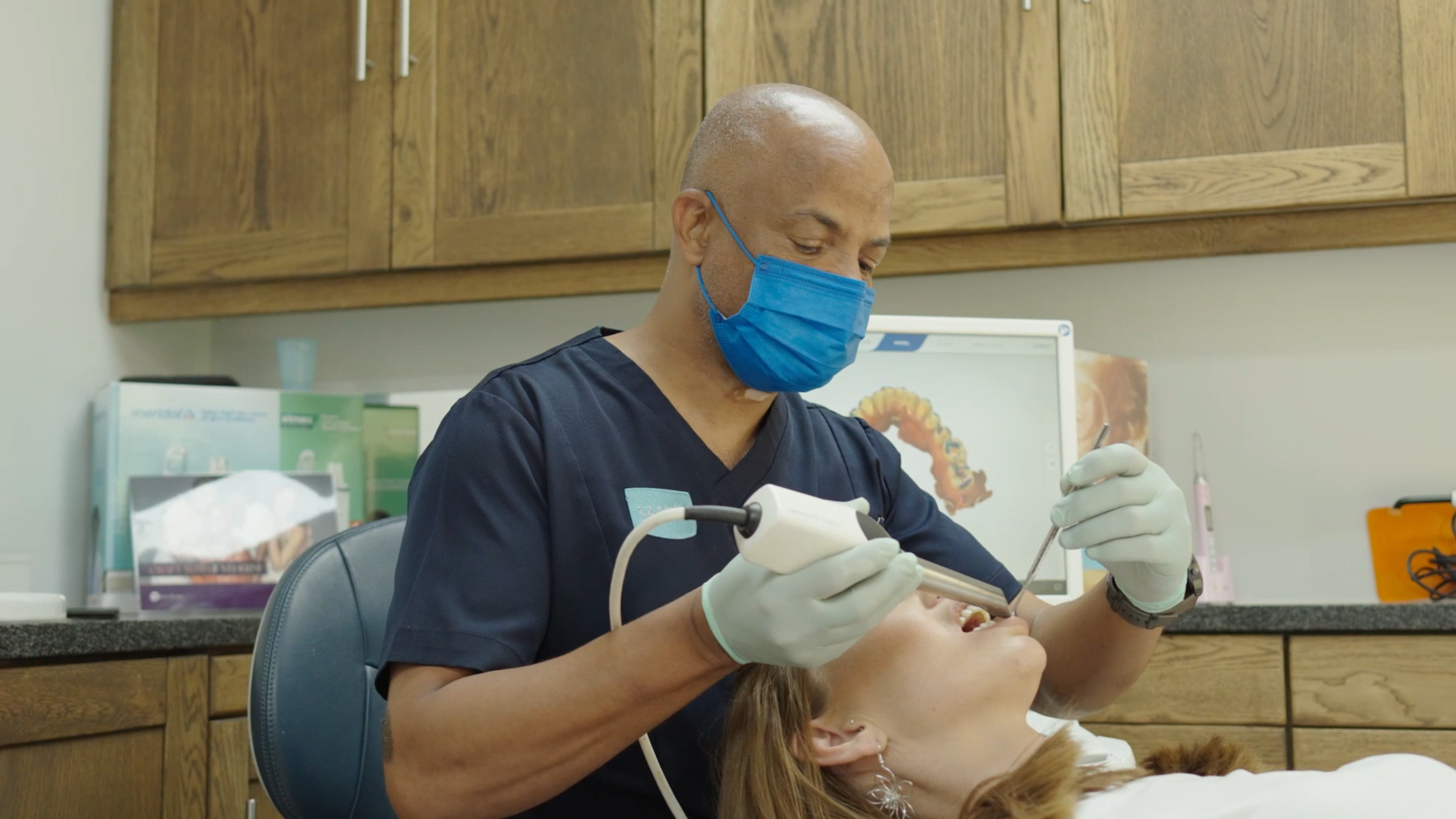 A dentist at Smile @ Kyalami treating a patient in the surgery