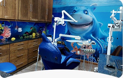 The underwater-themed paediatric dentistry room at Smile @ Kyalami, with a shark mural and a child-friendly dental chair